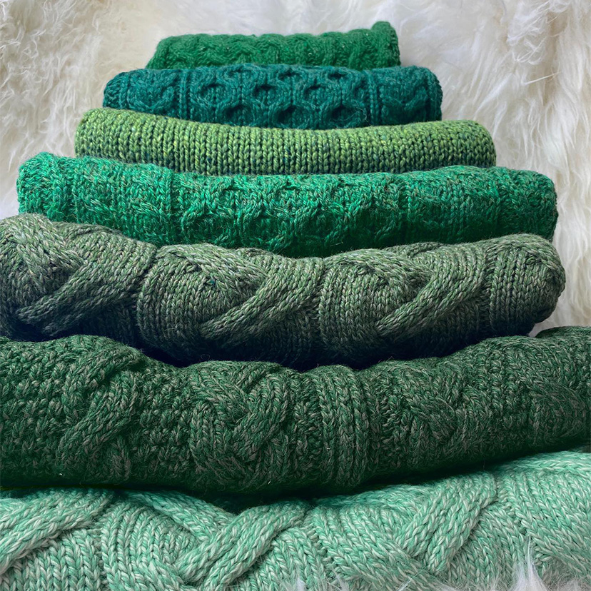 green authentic sweaters, green sweater pile, irish sweaters, handmade sweaters 